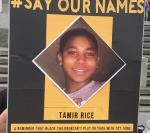 A #Say Our Names protest sign: Tamir Rice, a reminder that black children can’t play outside with toy guns.