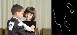 Two children dance in a ballroom dance competition